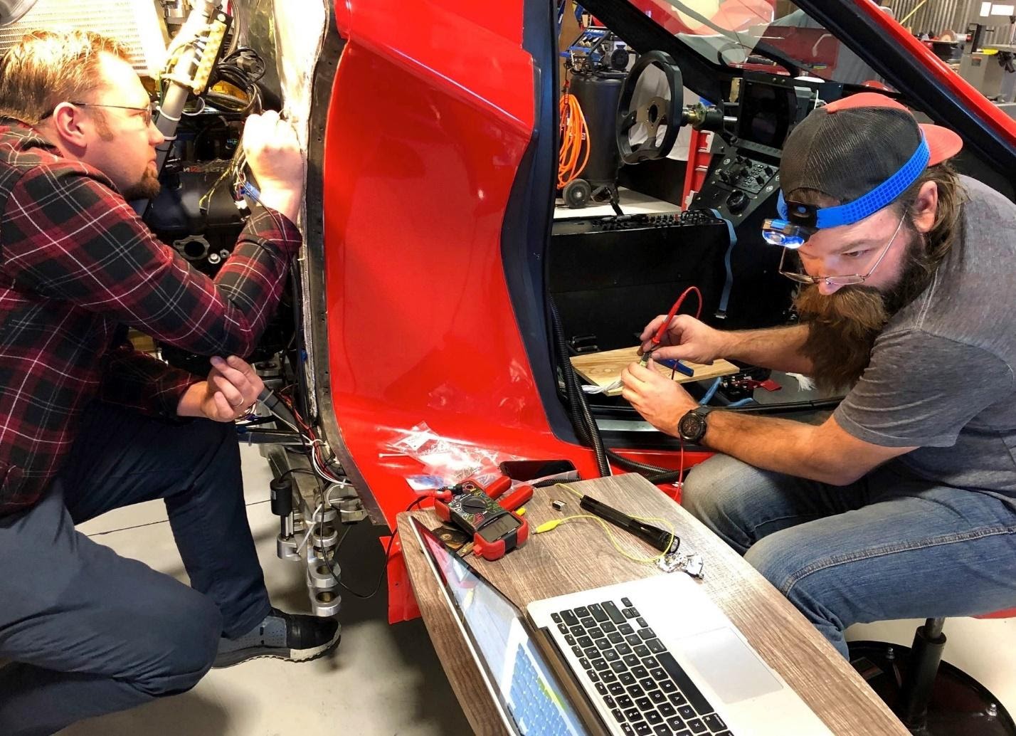 image6 men working on switchblade