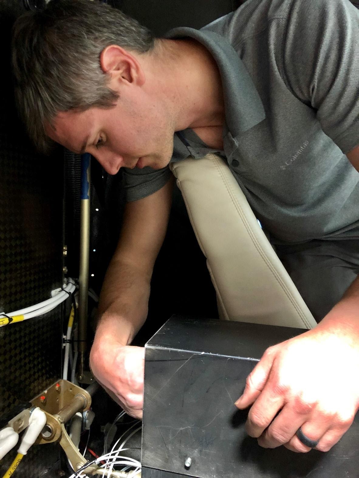 a man placing a ELT