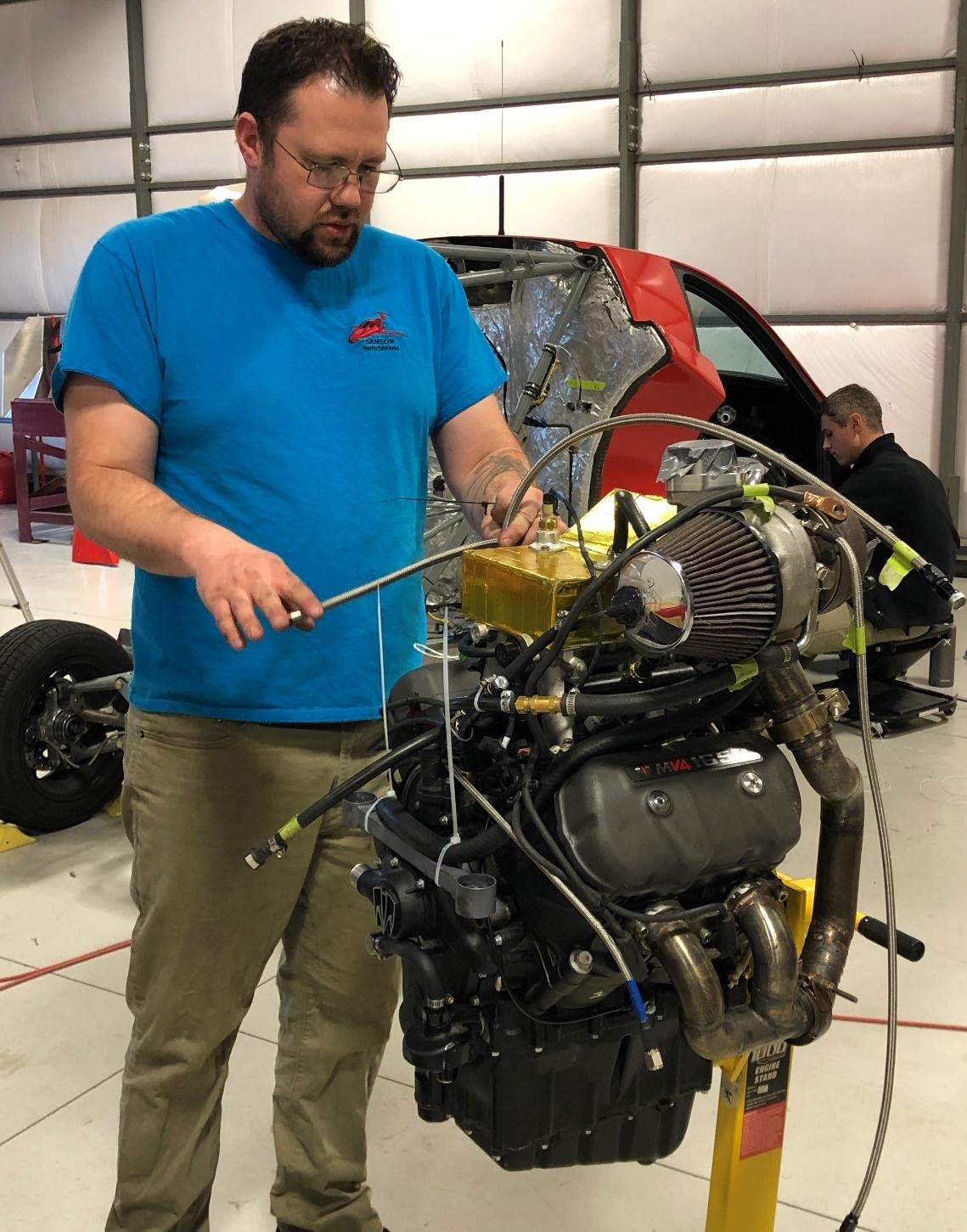 A man doing a engine inspection