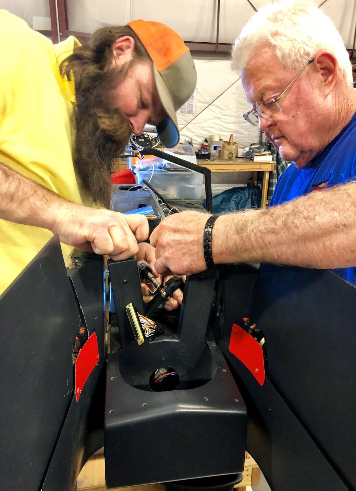 Two men working on the rudder