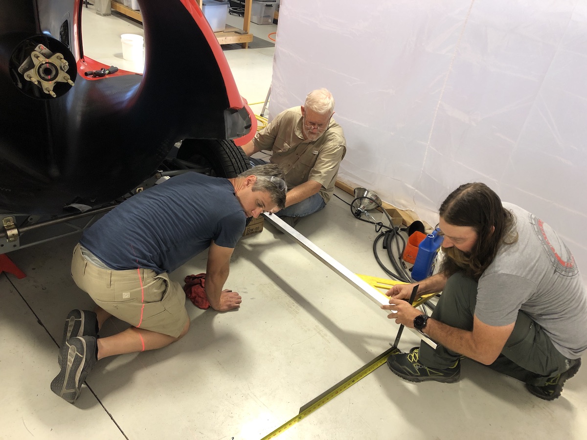 wheel alignment 7.29.20 three men doing wheel alignment on the switchblade