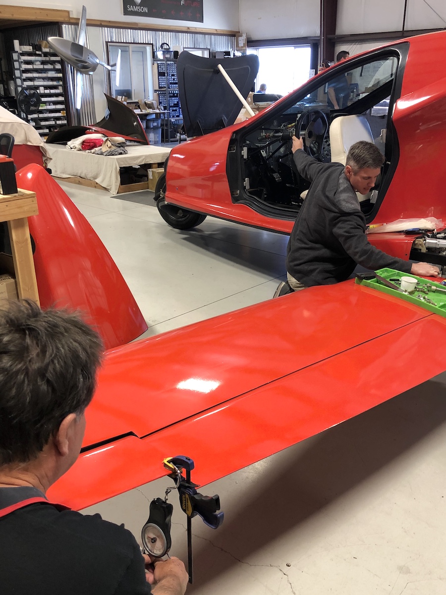 a man installing the new radiator fan into the custom shroud
