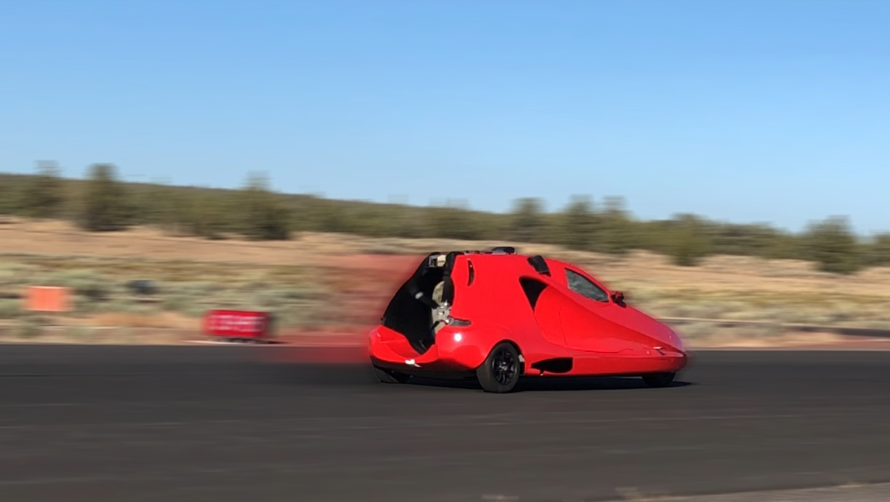 picture of a flying car moving fast on the ground