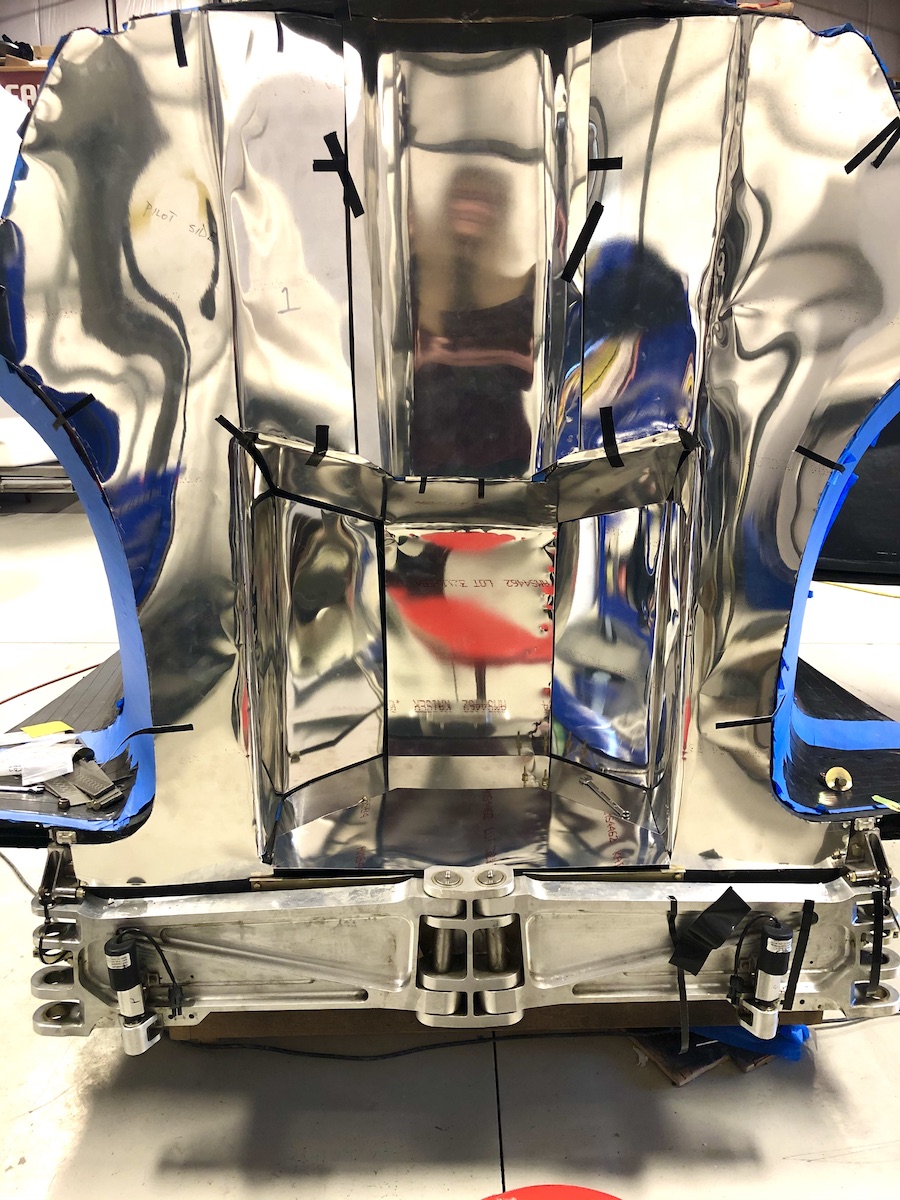 rear bulkhead with shiny aluminium sheet covering