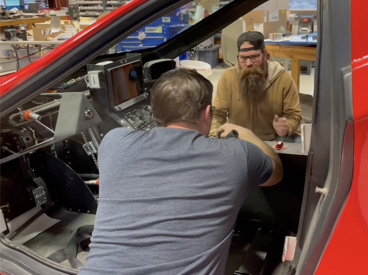 two people working in the cockpit of the samson sky switchblade flying car