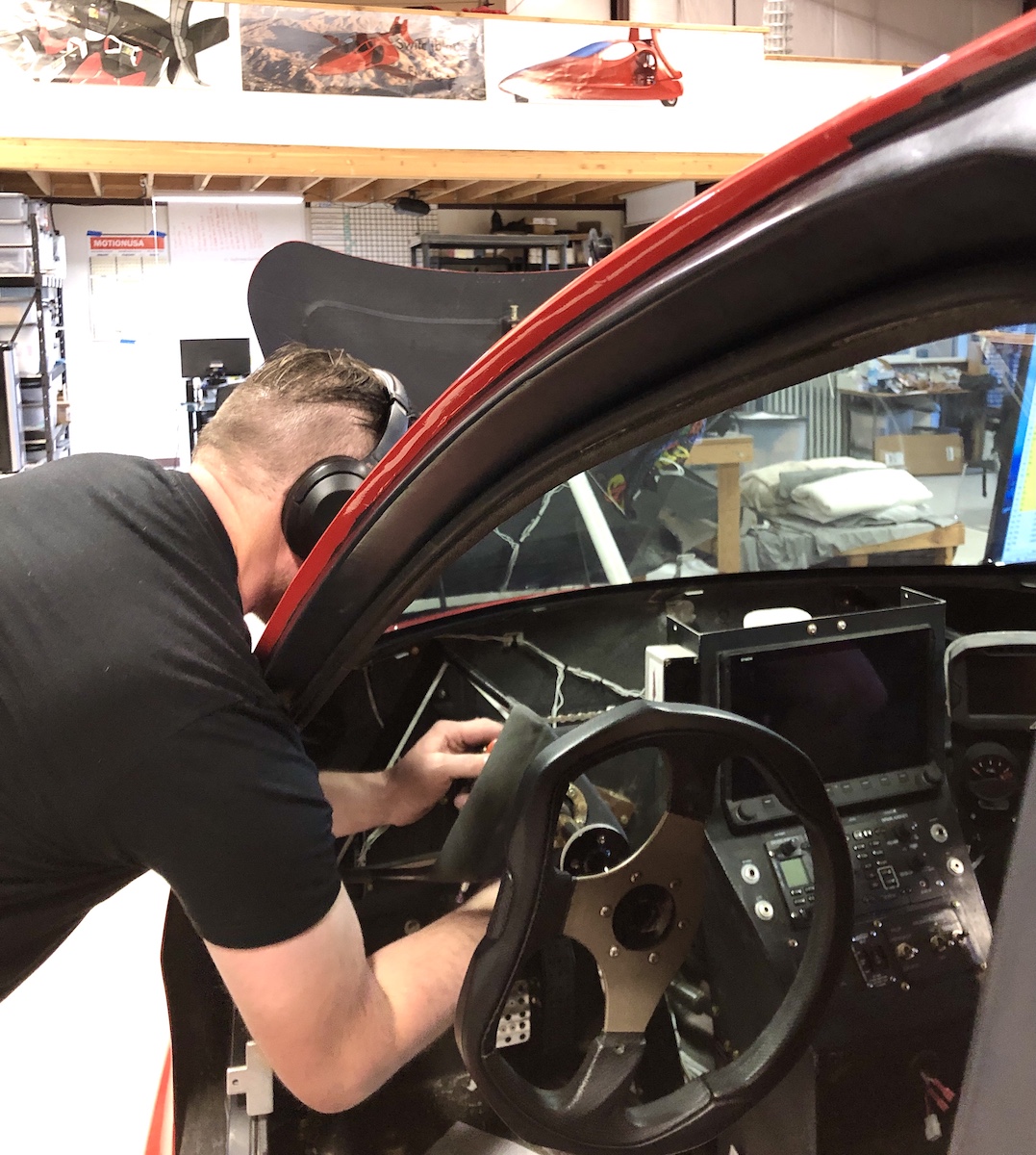 adjusting the steering 2.15.22 A person working on a car adjusting the steering