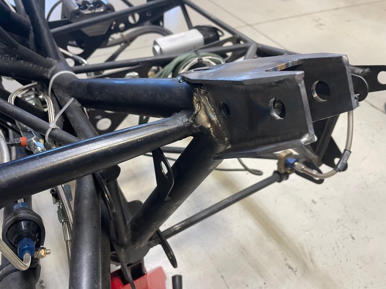 new A-arms 3.28.22 A picture containing tube frame after drop test