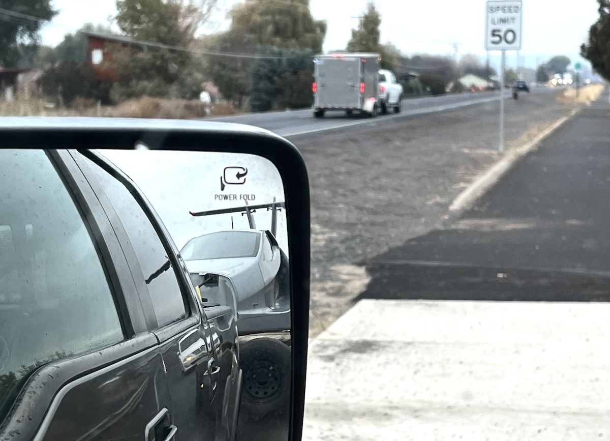 rear view shot – heading to Moses 11.01.23 picture of switchblade flying car in side view mirror, on trailer